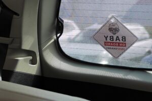 Snap Shades Baby on Board sign from inside the car